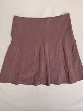 Athleta brand pleated athletic skort in a mauve or purple shade